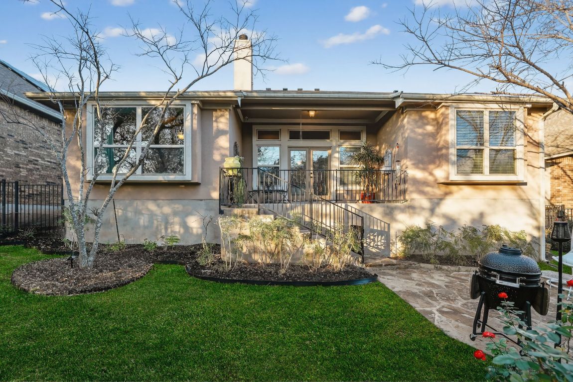4521 Pyrenees Pass Bee Cave, TX 78738 - Photo 19 of 22 a view of a house with backyard and sitting area