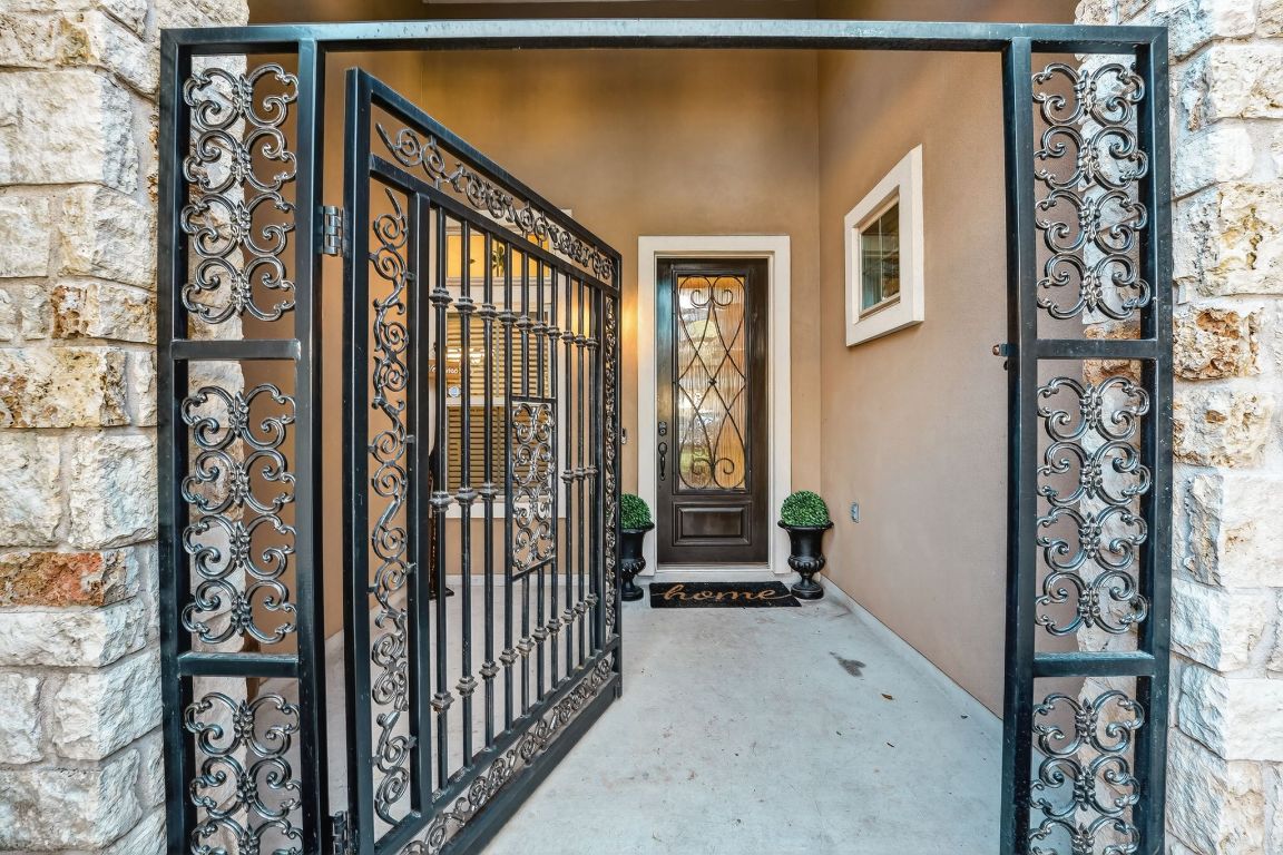 4521 Pyrenees Pass Bee Cave, TX 78738 - Photo 3 of 22 a view of a house with a street