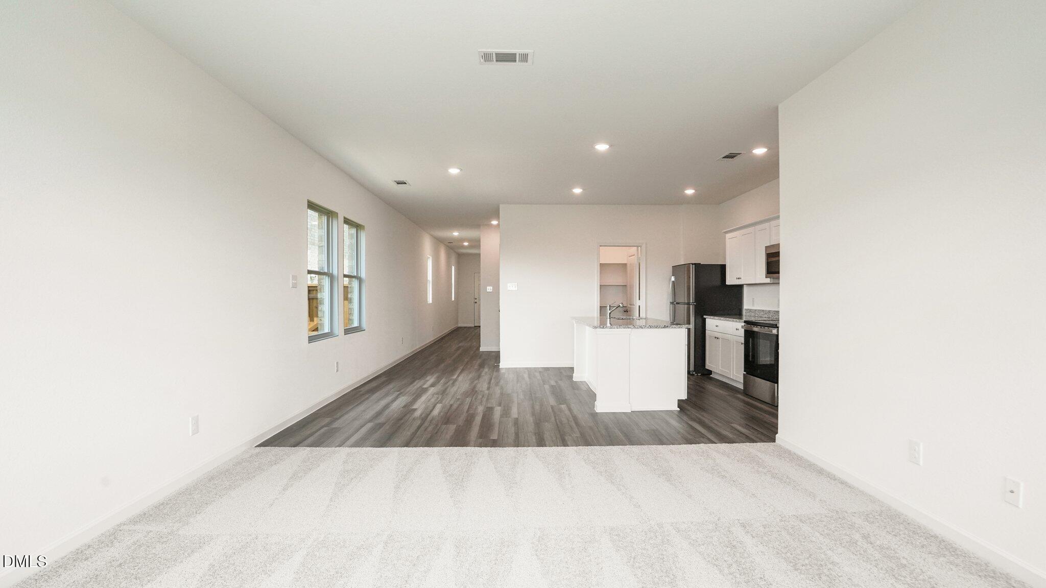 1304 Solace Way Rolesville, NC 27571 - Photo 11 of 34 a view or kitchen with cabinets and wooden floor