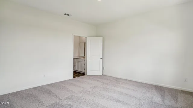 a view of hallway with wooden floor