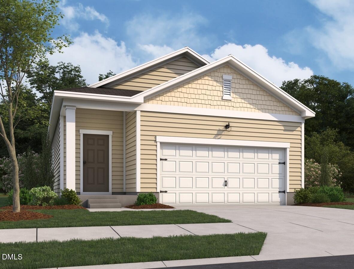 1304 Solace Way Rolesville, NC 27571 - Photo 2 of 34 a front view of a house with a yard