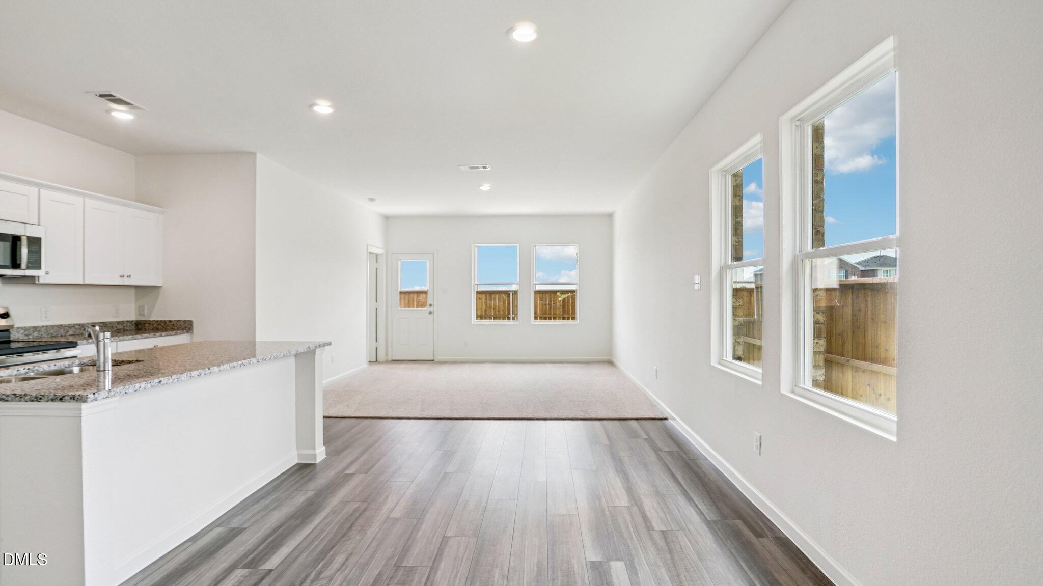 1304 Solace Way Rolesville, NC 27571 - Photo 5 of 34 a large white kitchen with cabinets