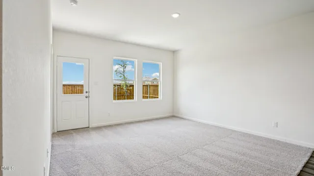 a view of a kitchen with wooden floor and a sink