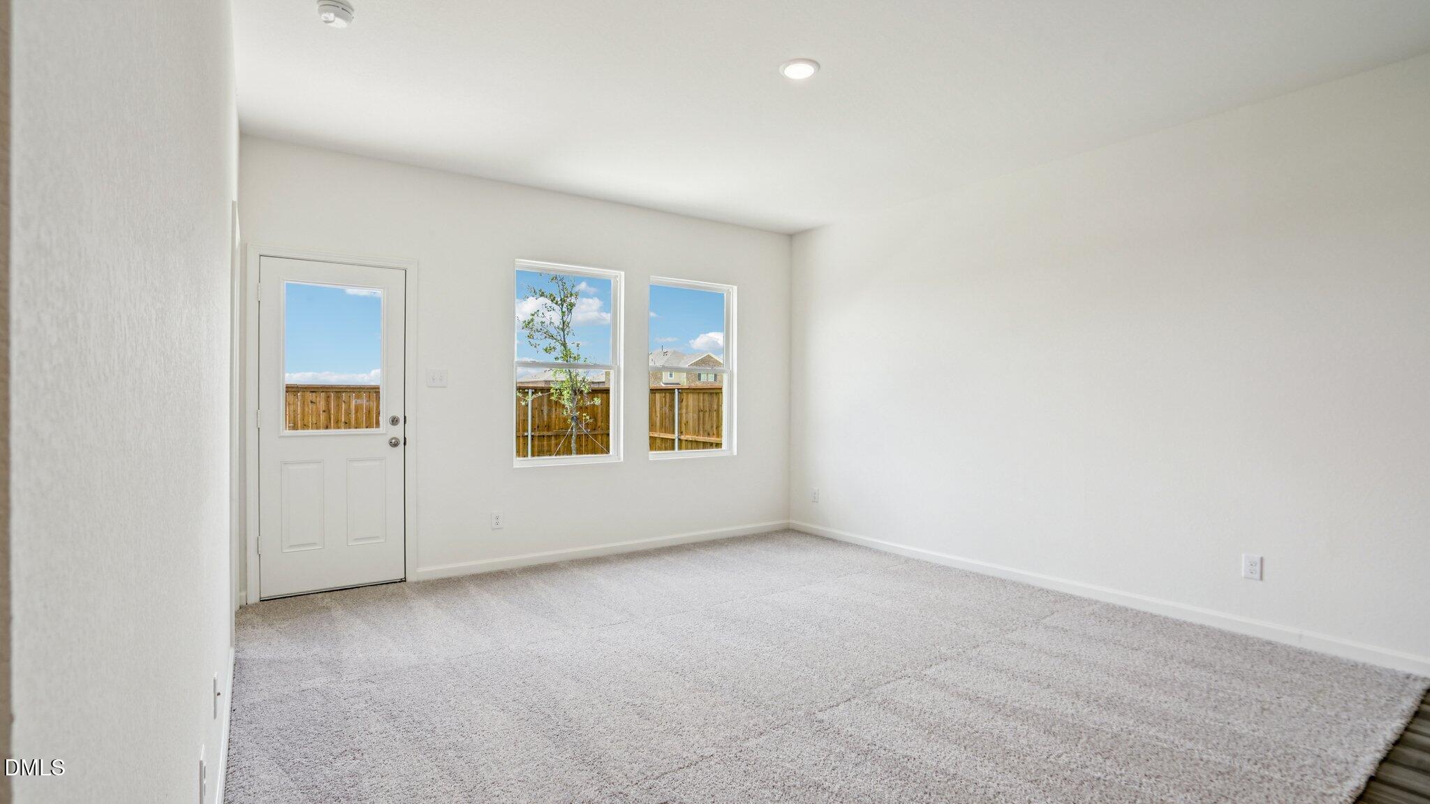 1304 Solace Way Rolesville, NC 27571 - Photo 9 of 34 an empty room with windows