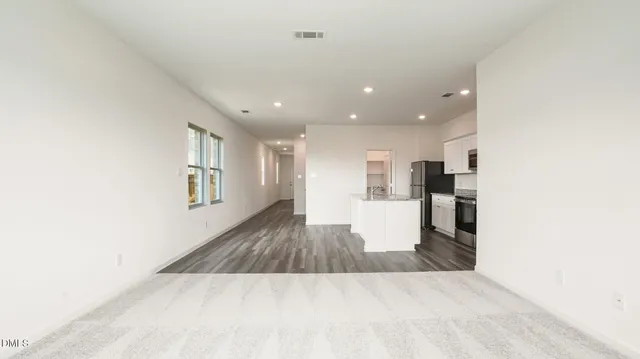 a kitchen that has a sink and a stove