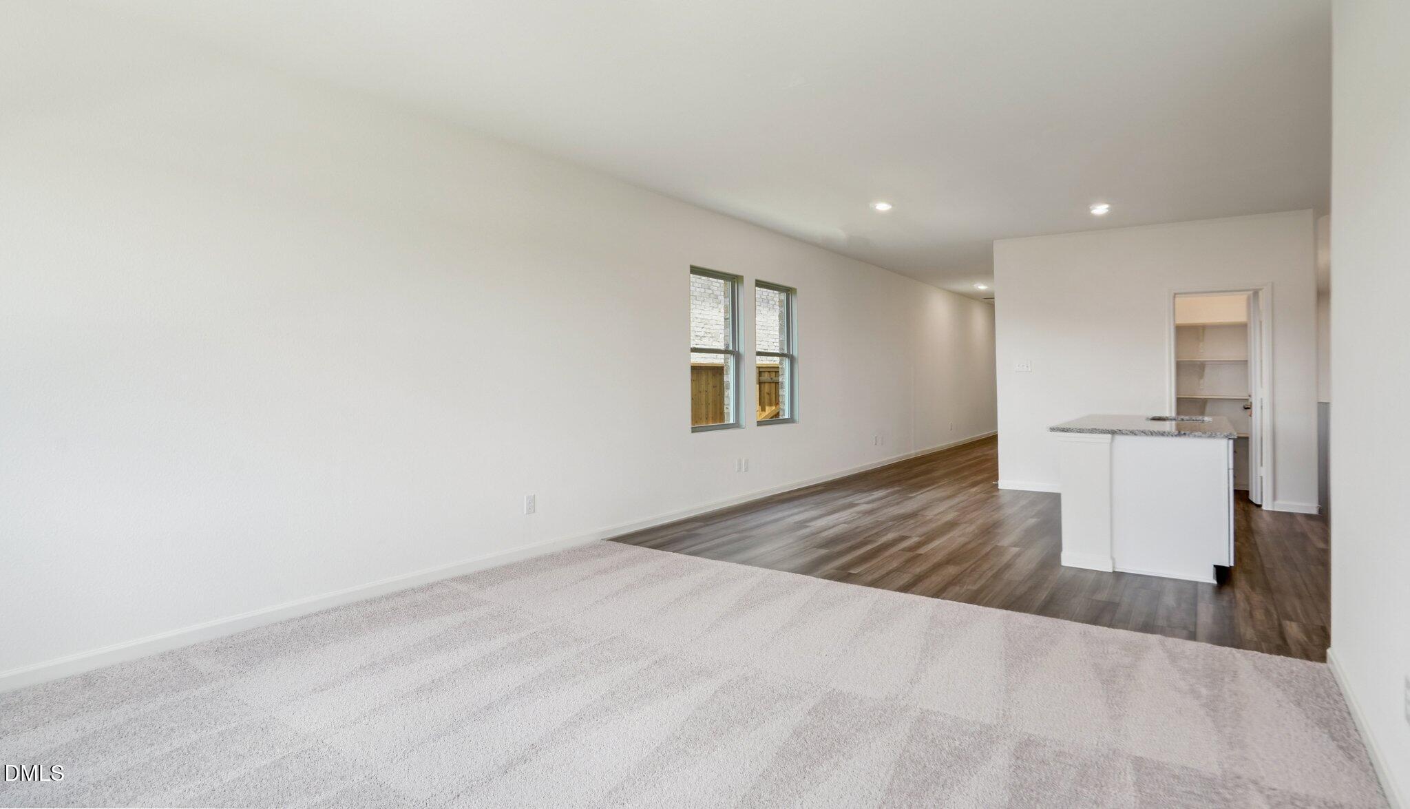 1304 Solace Way Rolesville, NC 27571 - Photo 10 of 34 a view of a kitchen with wooden floor and a sink
