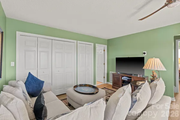 a living room with furniture and a lamp