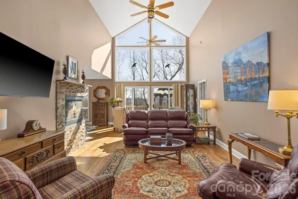 a living room with furniture a rug and a window