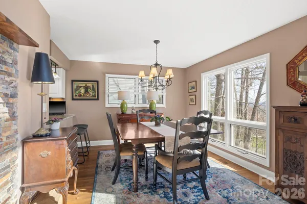 a view of a dining room with furniture window and outside view