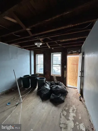 a view of room with wooden floor