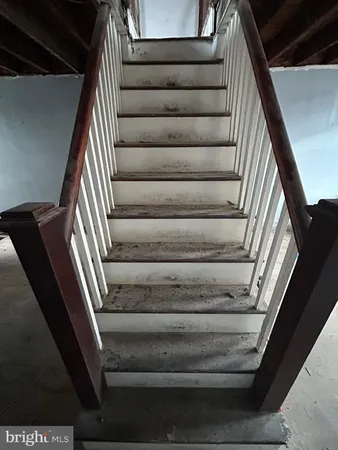 a view of an empty room with stairs