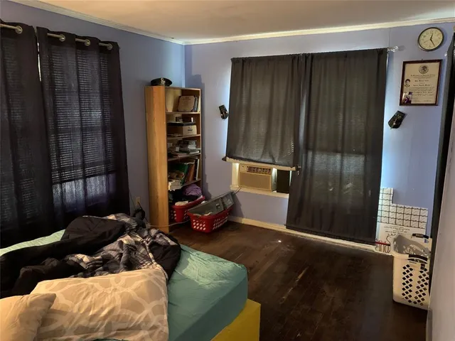 a bed room with a bed and a window