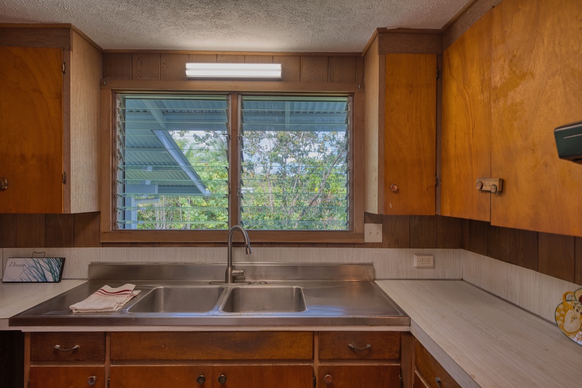 27-296 Ka'ie'ie Road Papaikou, HI 96781 - Photo 12 of 28 a kitchen with a sink and a window