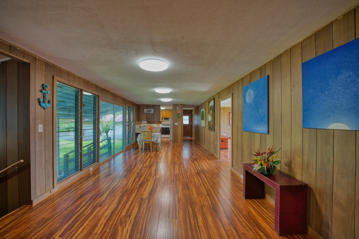 27-296 Ka'ie'ie Road Papaikou, HI 96781 - Photo 2 of 28 a view of a living room hardwood floor and furniture