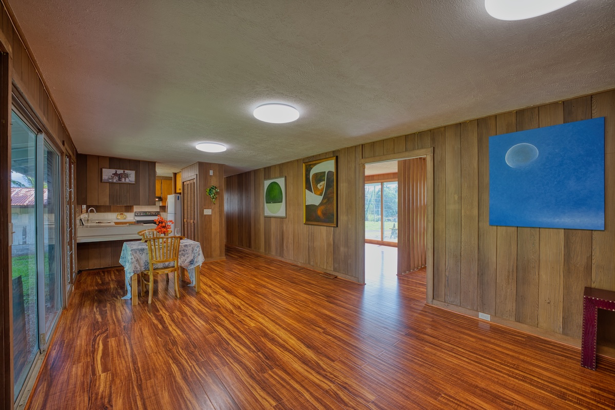 27-296 Ka'ie'ie Road Papaikou, HI 96781 - Photo 24 of 28 a view of a room with furniture and wooden floor