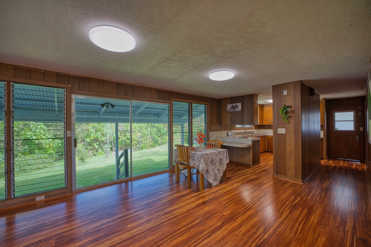 27-296 Ka'ie'ie Road Papaikou, HI 96781 - Photo 5 of 28 a view of a dining room with furniture window and wooden floor