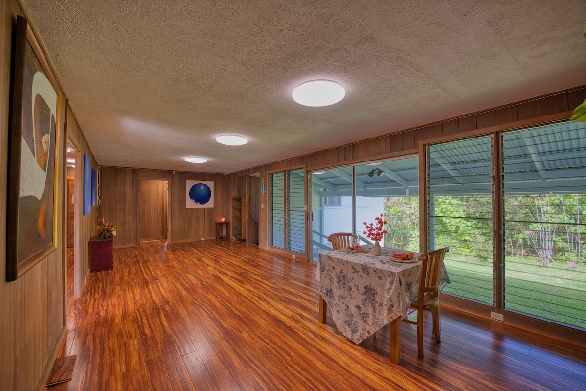 27-296 Ka'ie'ie Road Papaikou, HI 96781 - Photo 7 of 28 a living room with furniture and wooden floor