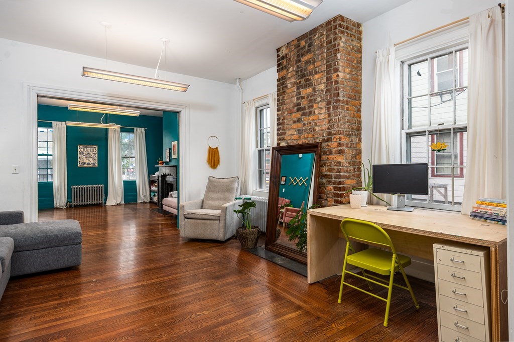 206 Smith Street Providence, RI 02908 - Photo 13 of 40 a view of a livingroom with furniture window and wooden floor