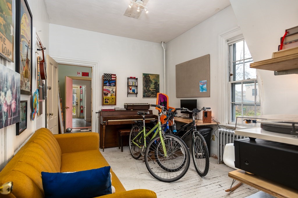206 Smith Street Providence, RI 02908 - Photo 19 of 40 a living room with furniture a flat screen tv and a window
