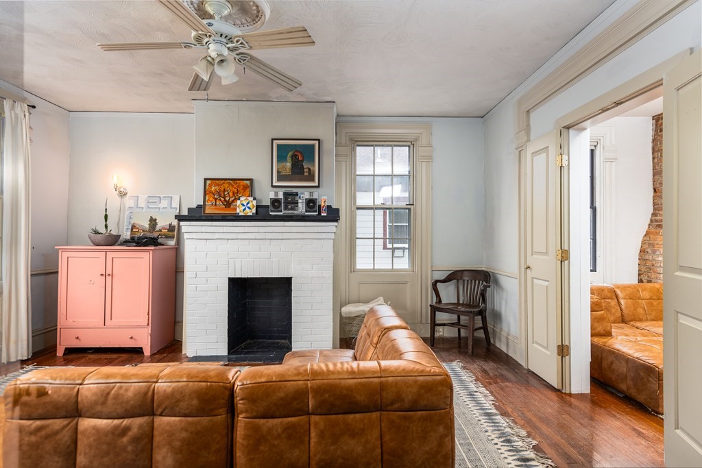 206 Smith Street Providence, RI 02908 - Photo 21 of 40 a living room with furniture and a fireplace
