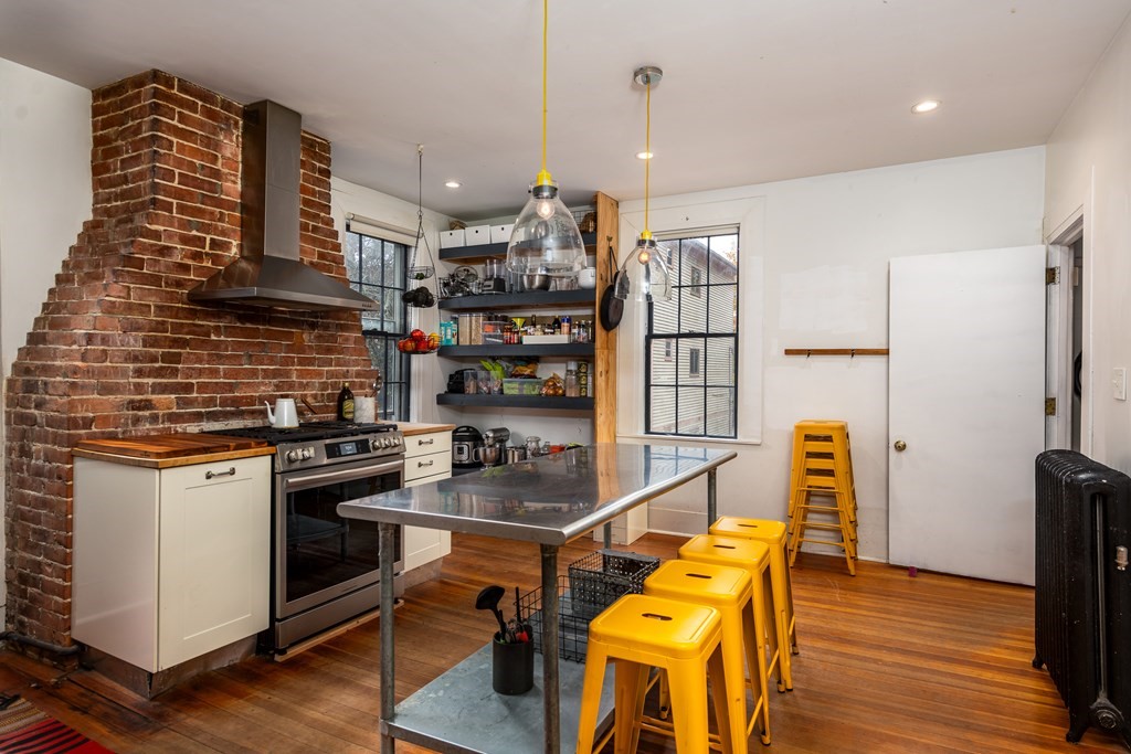 206 Smith Street Providence, RI 02908 - Photo 27 of 40 a kitchen with stainless steel appliances granite countertop a stove and a refrigerator