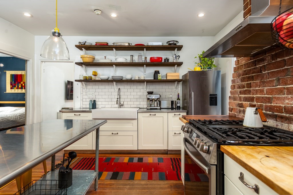 206 Smith Street Providence, RI 02908 - Photo 29 of 40 a kitchen that has a lot of cabinets in it