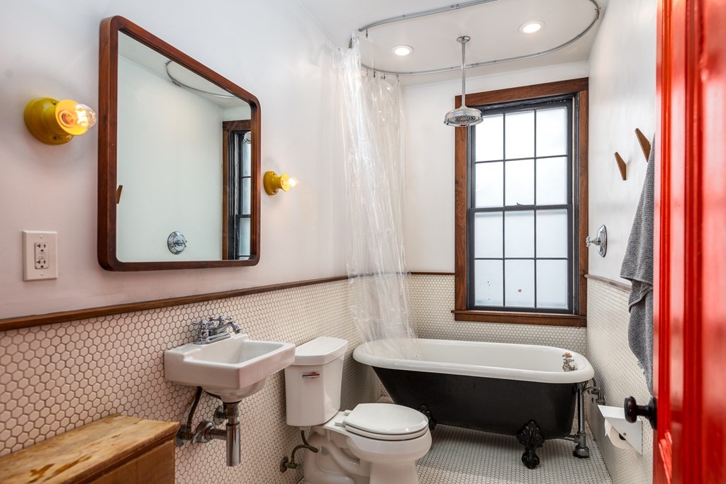 206 Smith Street Providence, RI 02908 - Photo 31 of 40 a bathroom with a sink toilet and mirror