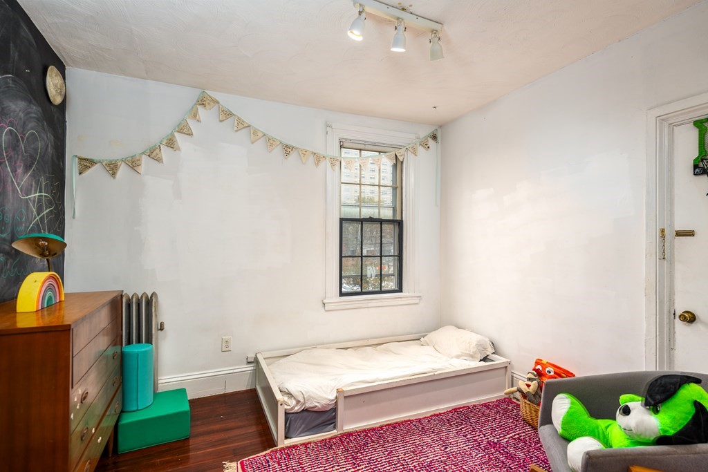 206 Smith Street Providence, RI 02908 - Photo 34 of 40 a bedroom with a bed and a window