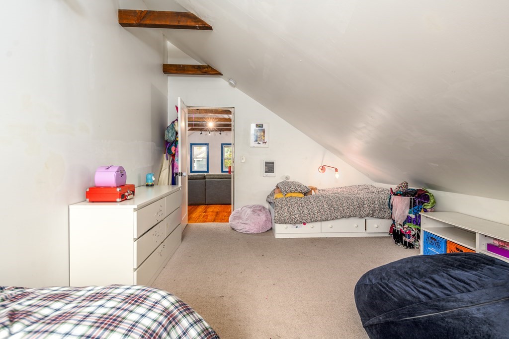 206 Smith Street Providence, RI 02908 - Photo 38 of 40 a bedroom with a bed and a couch