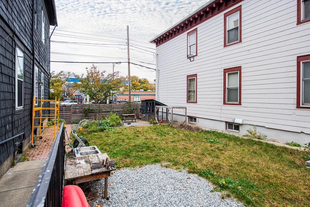206 Smith Street Providence, RI 02908 - Photo 7 of 40 a house view with a garden space