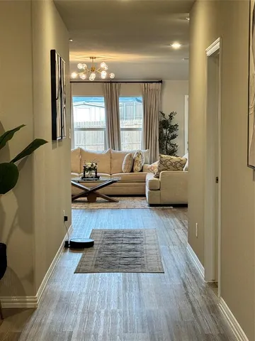 a bedroom with a bed dresser and a window