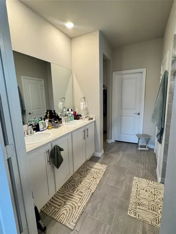 a bathroom with a sink and a window