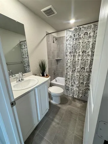 a bedroom with a bed and a cabinets