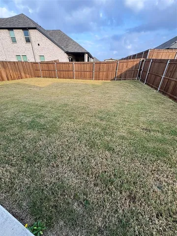 a view of houses with outdoor space and city view