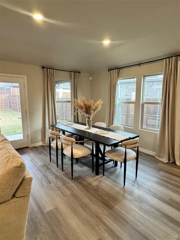 a view of a livingroom with furniture and a window