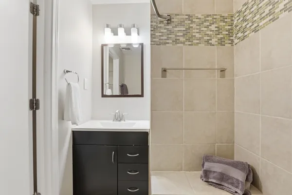 a bathroom with a shower and a shower