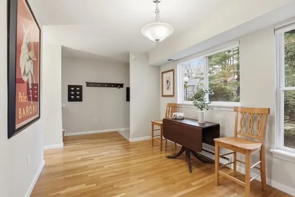 a view of a livingroom with workspace and a window