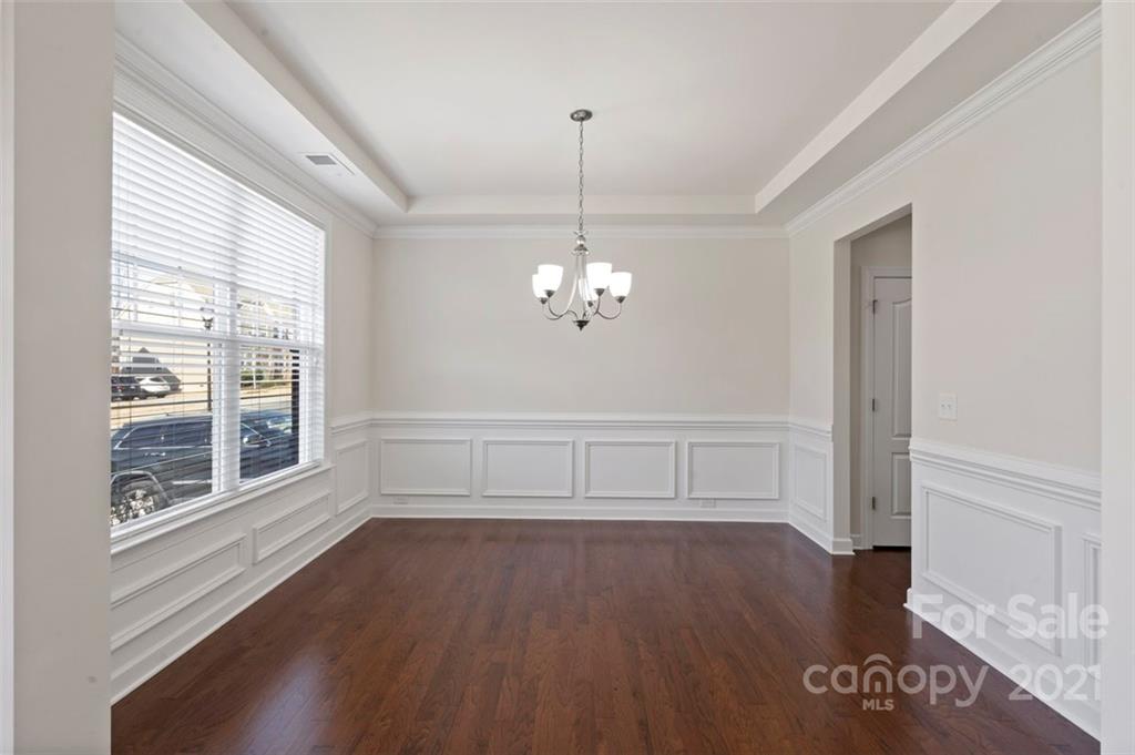 4331 Oxford Mill Road Waxhaw, NC 28173 - Photo 5 of 48 a view of wooden floor chandelier and windows in a room