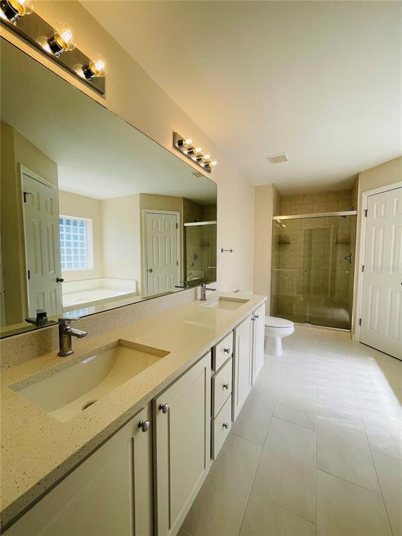117 Angol Street Punta Gorda, FL 33983 - Photo 11 of 20 a bathroom with a granite countertop sink and a large mirror