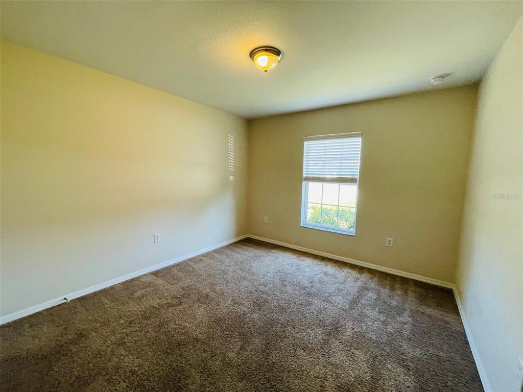 117 Angol Street Punta Gorda, FL 33983 - Photo 15 of 20 an empty room with a empty space and a window