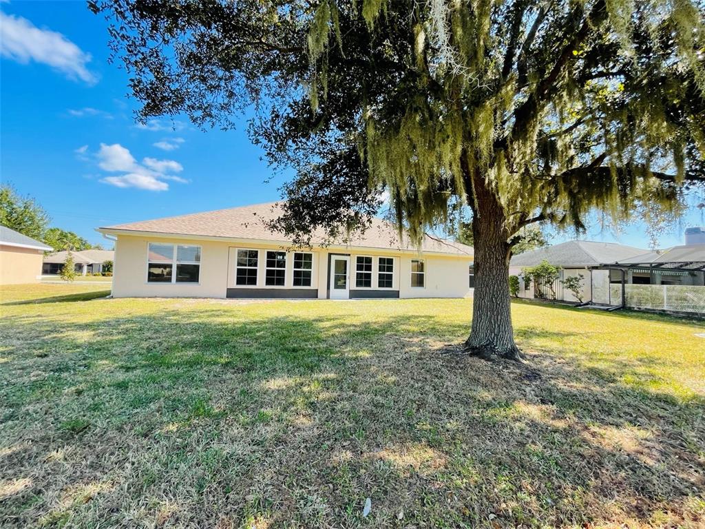 117 Angol Street Punta Gorda, FL 33983 - Photo 20 of 20 a front view of a house with garden