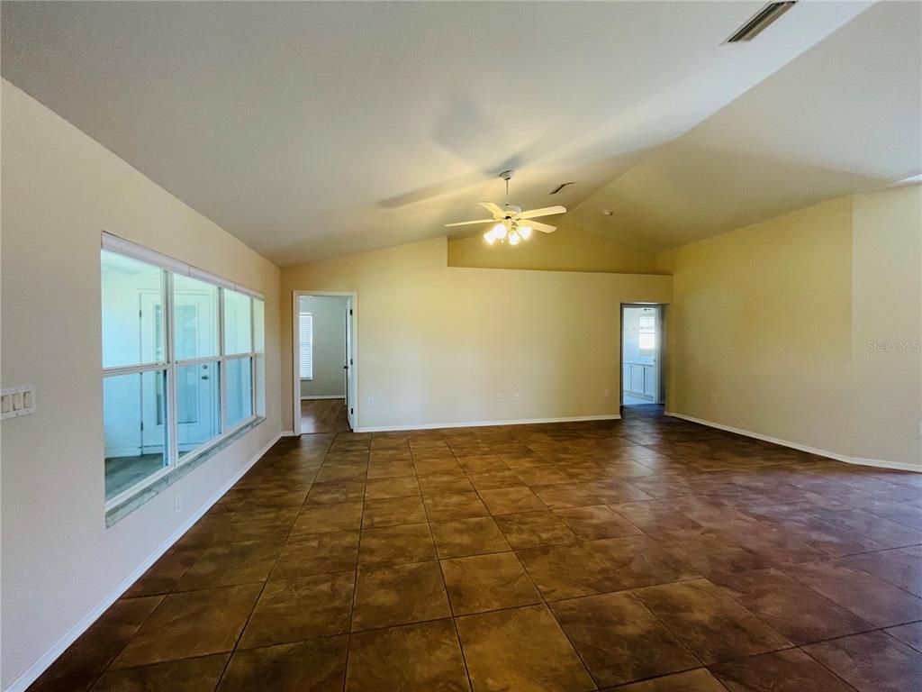 117 Angol Street Punta Gorda, FL 33983 - Photo 4 of 20 a view of an empty room with a window