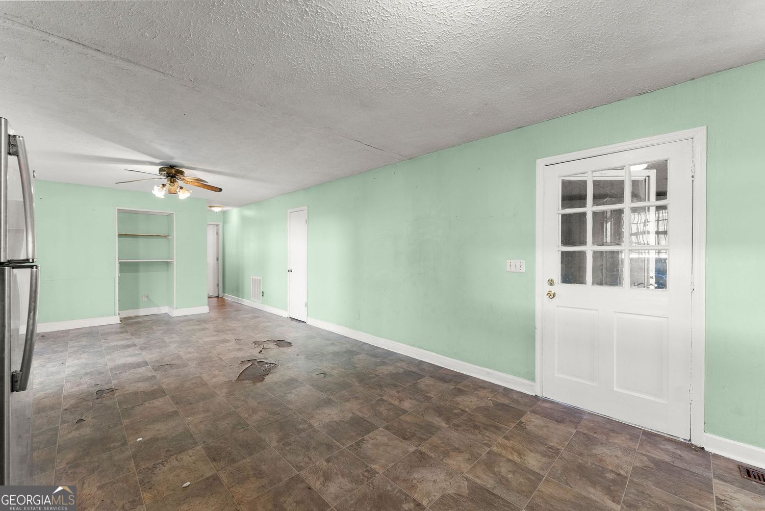 2346 4th Street Gainesville, GA 30504 - Photo 7 of 36 an empty room with windows and cabinet
