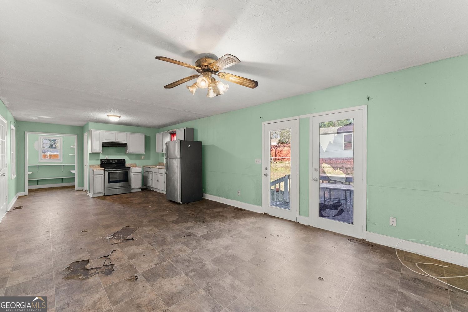 2346 4th Street Gainesville, GA 30504 - Photo 8 of 36 a view of a livingroom with furniture and a ceiling fan