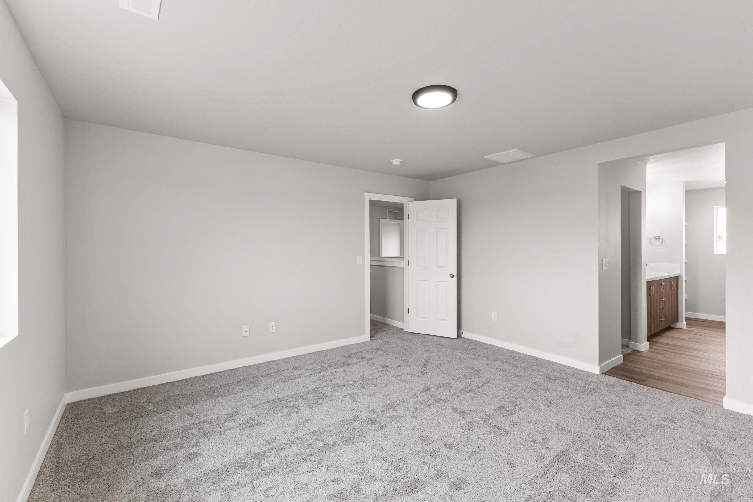 461 Waverly Avenue Middleton, ID 83644 - Photo 18 of 22 Unfurnished bedroom with light carpet and connected bathroom