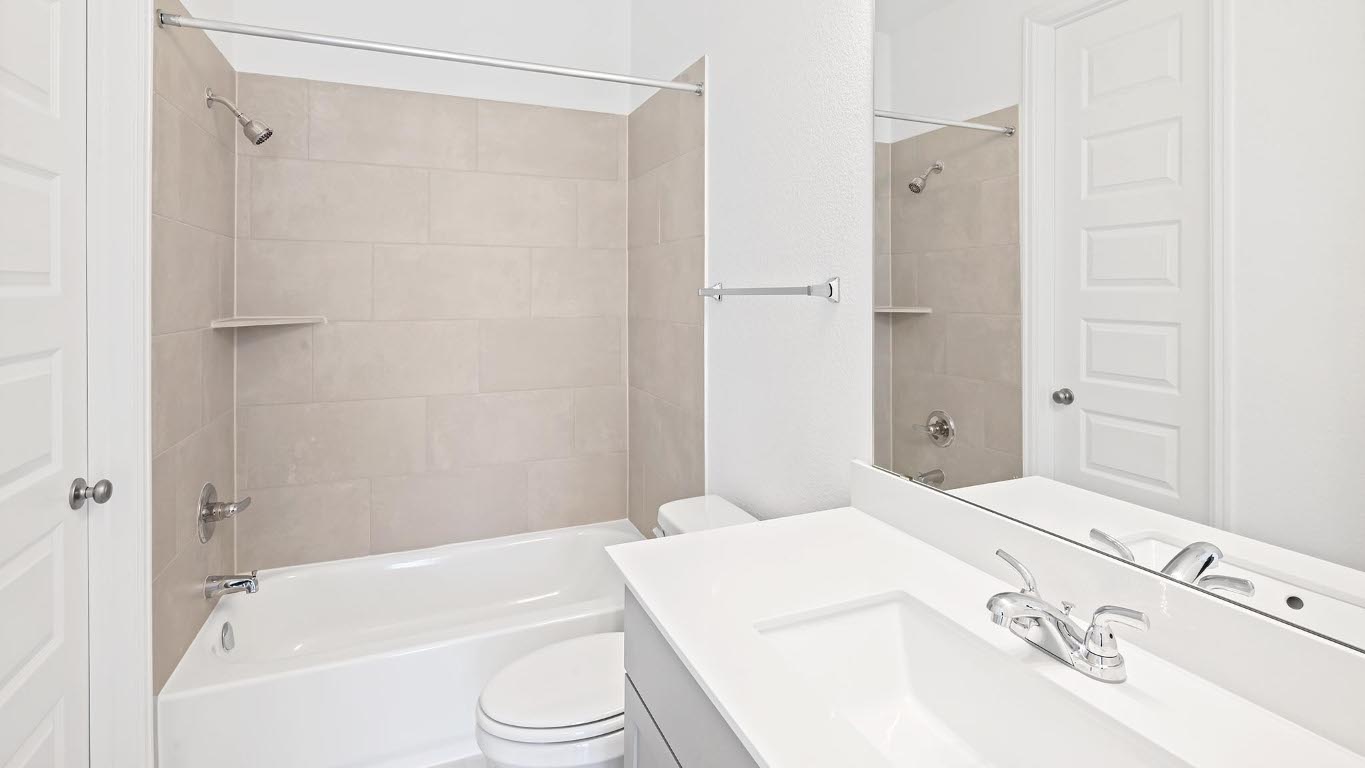 444 Prickly Poppy Loop Kyle, TX 78640 - Photo 18 of 40 Bathroom featuring bathing tub / shower combination and vanity