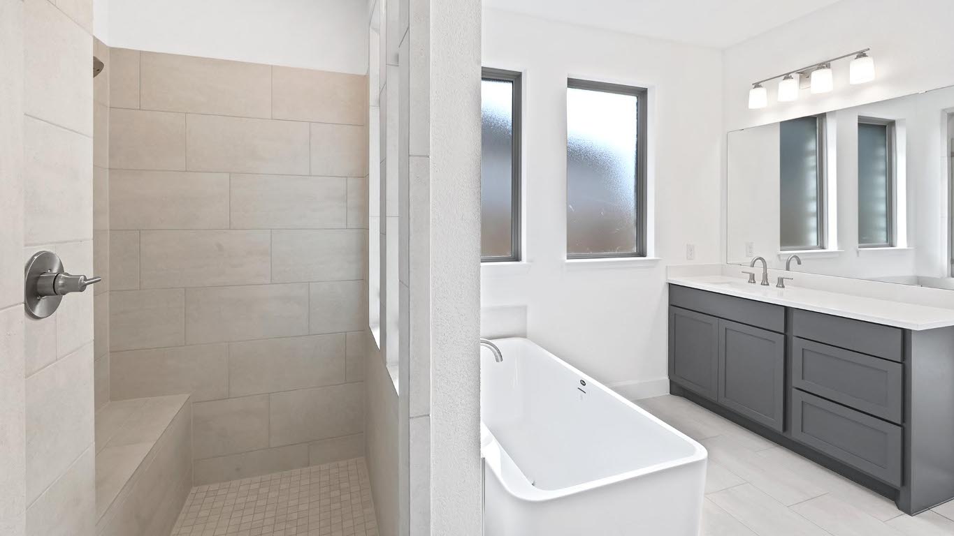 444 Prickly Poppy Loop Kyle, TX 78640 - Photo 20 of 40 Full bath with a soaking tub, vanity, and a walk in shower