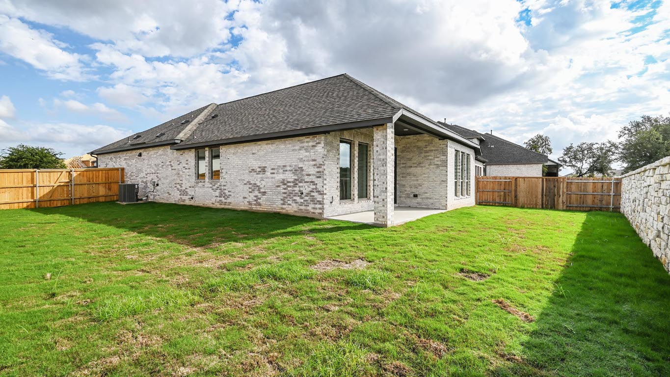 444 Prickly Poppy Loop Kyle, TX 78640 - Photo 22 of 40 Rear view of house featuring a patio area, a fenced backyard, brick siding, and a shingled roof