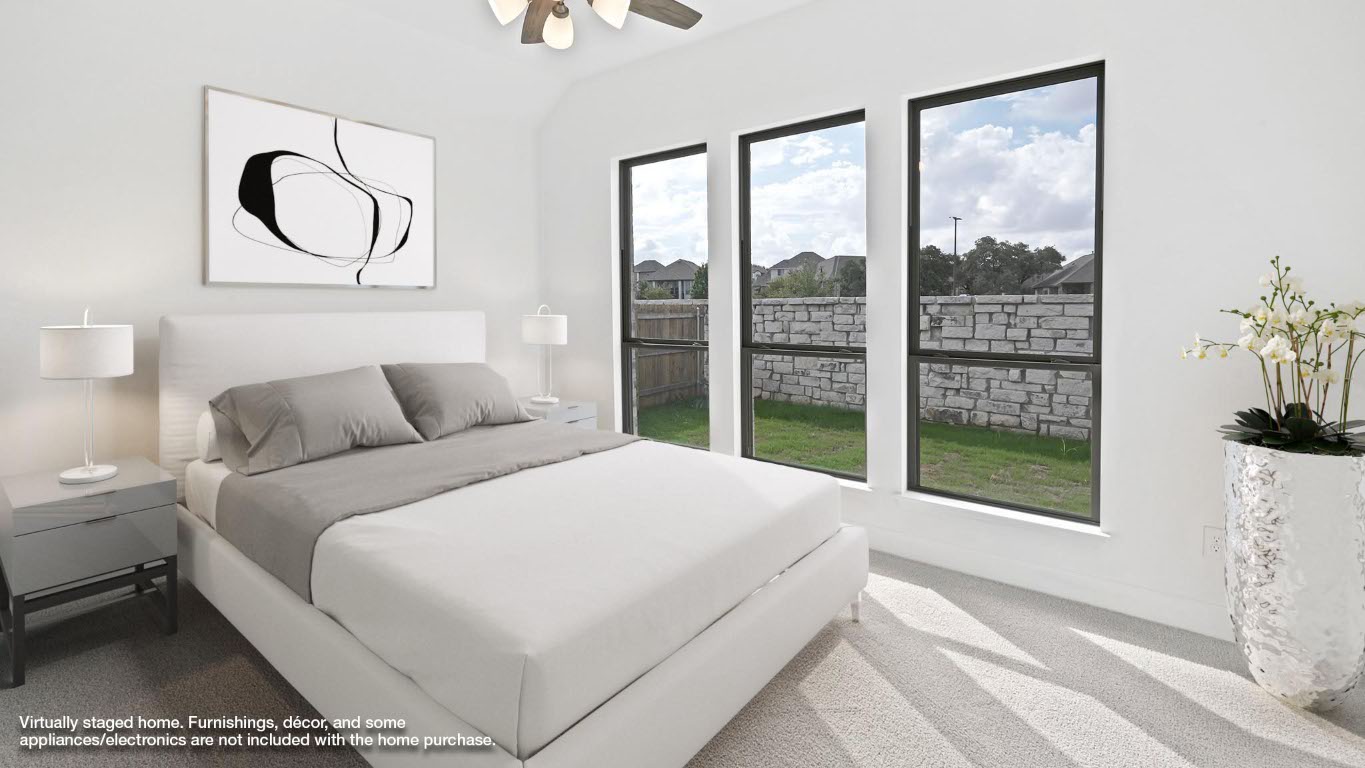 444 Prickly Poppy Loop Kyle, TX 78640 - Photo 6 of 40 Bedroom featuring carpet, a ceiling fan, and vaulted ceiling