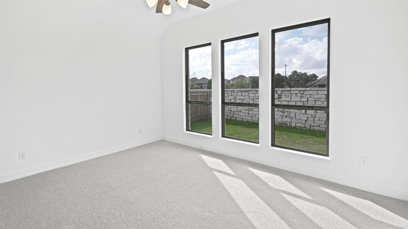 444 Prickly Poppy Loop Kyle, TX 78640 - Photo 10 of 40 Unfurnished room with light colored carpet, ceiling fan, and lofted ceiling